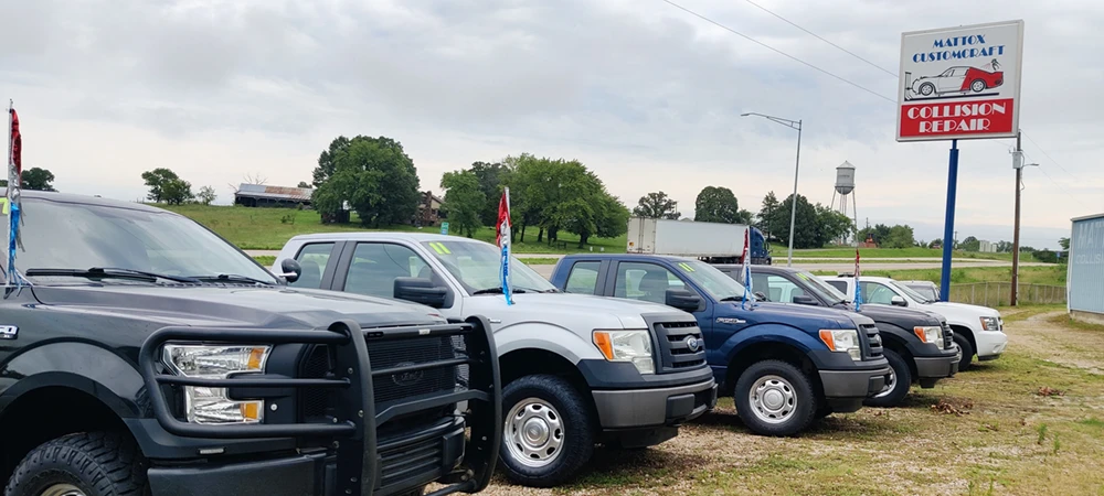 Sign and vehicles at Mattox Auto Sales